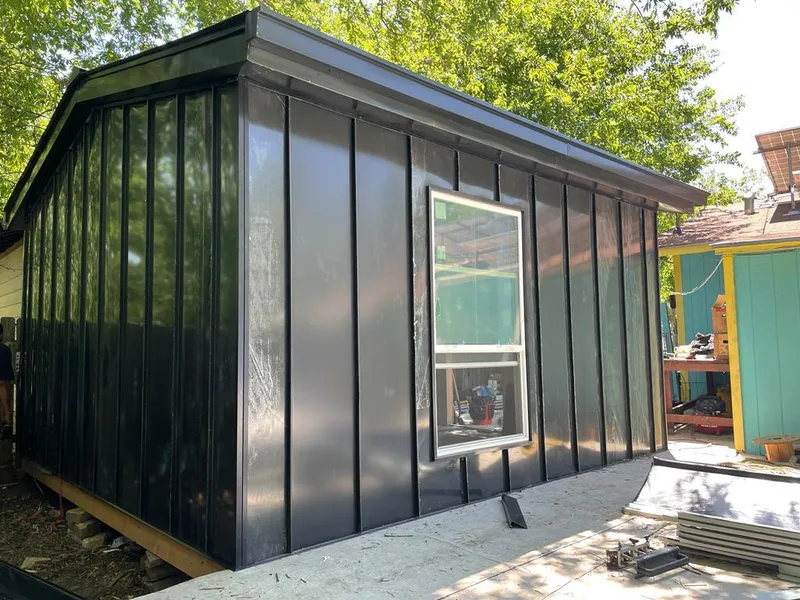 Black standing seam metal wall panels for Roof Inspection in Todd Creek